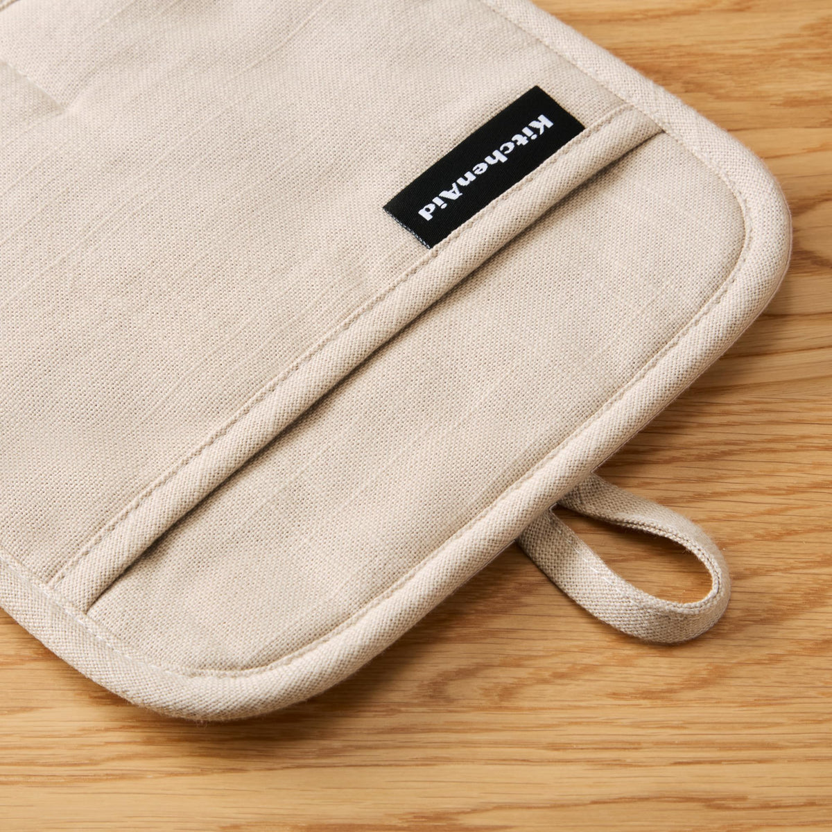 KitchenAid two-pack 8x8 milkshake tan pot holders for versatile kitchen use.