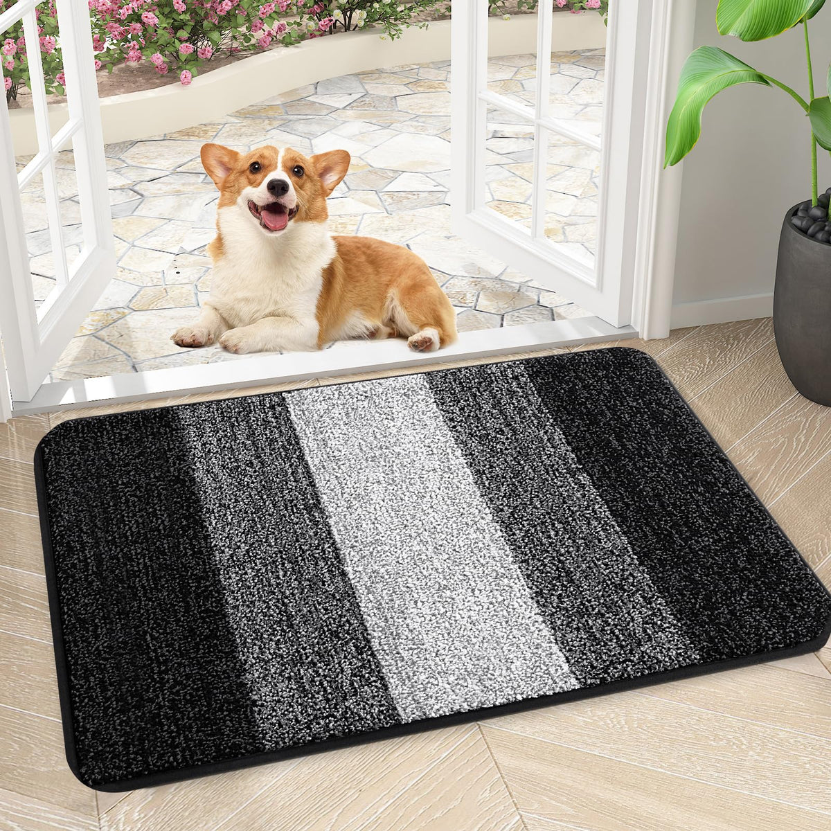 Kitinjoy door mat front entry with absorbent fibers traps moisture and dirt.