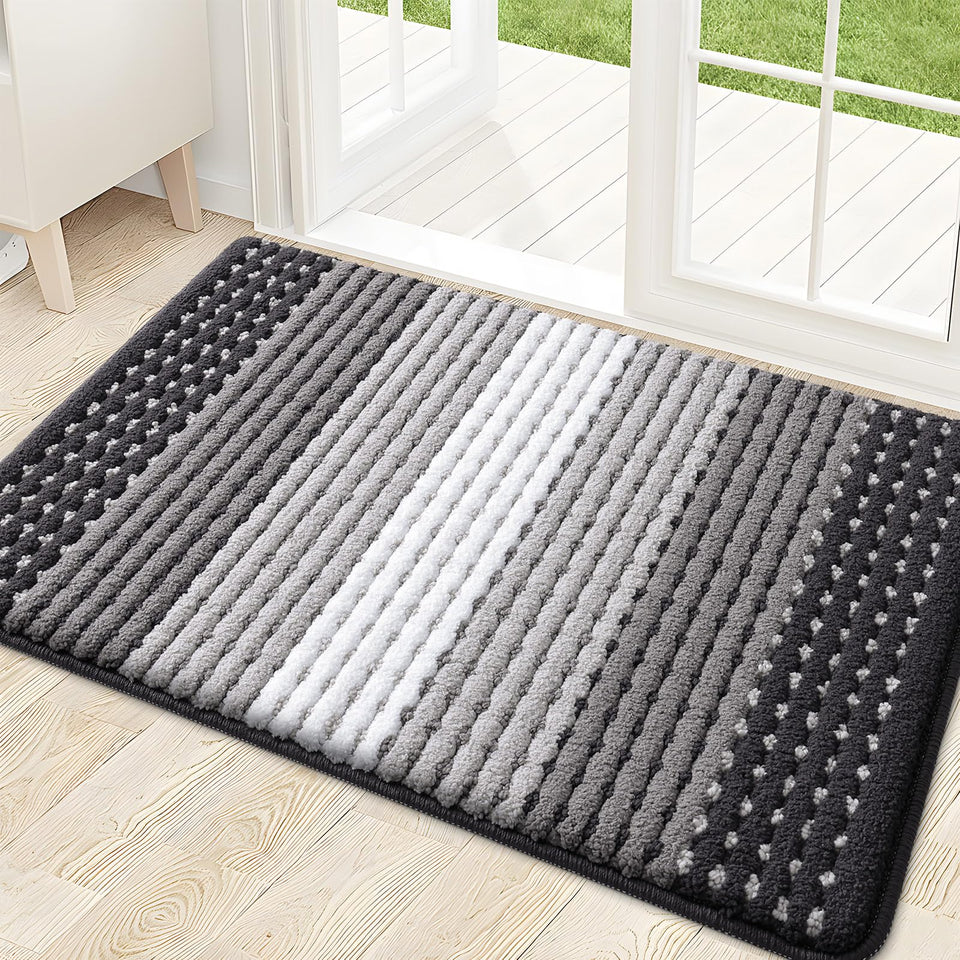 Kitinjoy indoor-outdoor door mat 32x20; absorbs moisture and dirt for cleaner entryways.