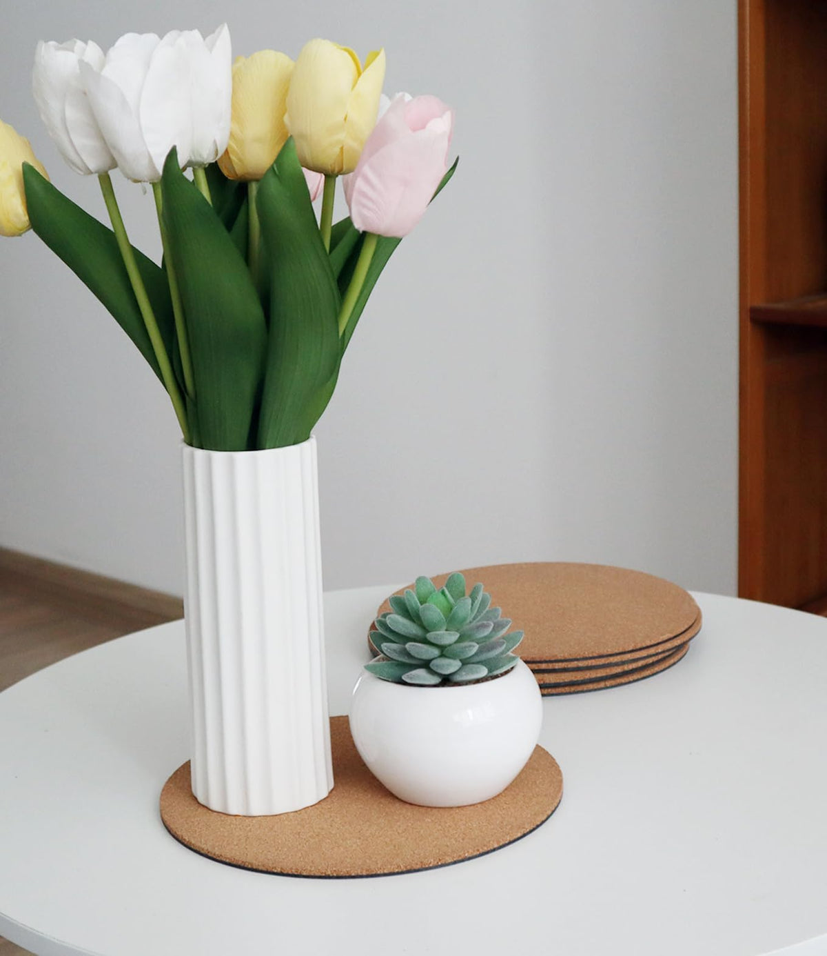 KITLAB cork plant coasters blend with decor while absorbing water.