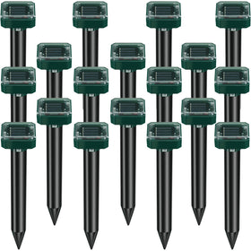 Kittmip mole repellent stake deters moles in a sunlit lawn