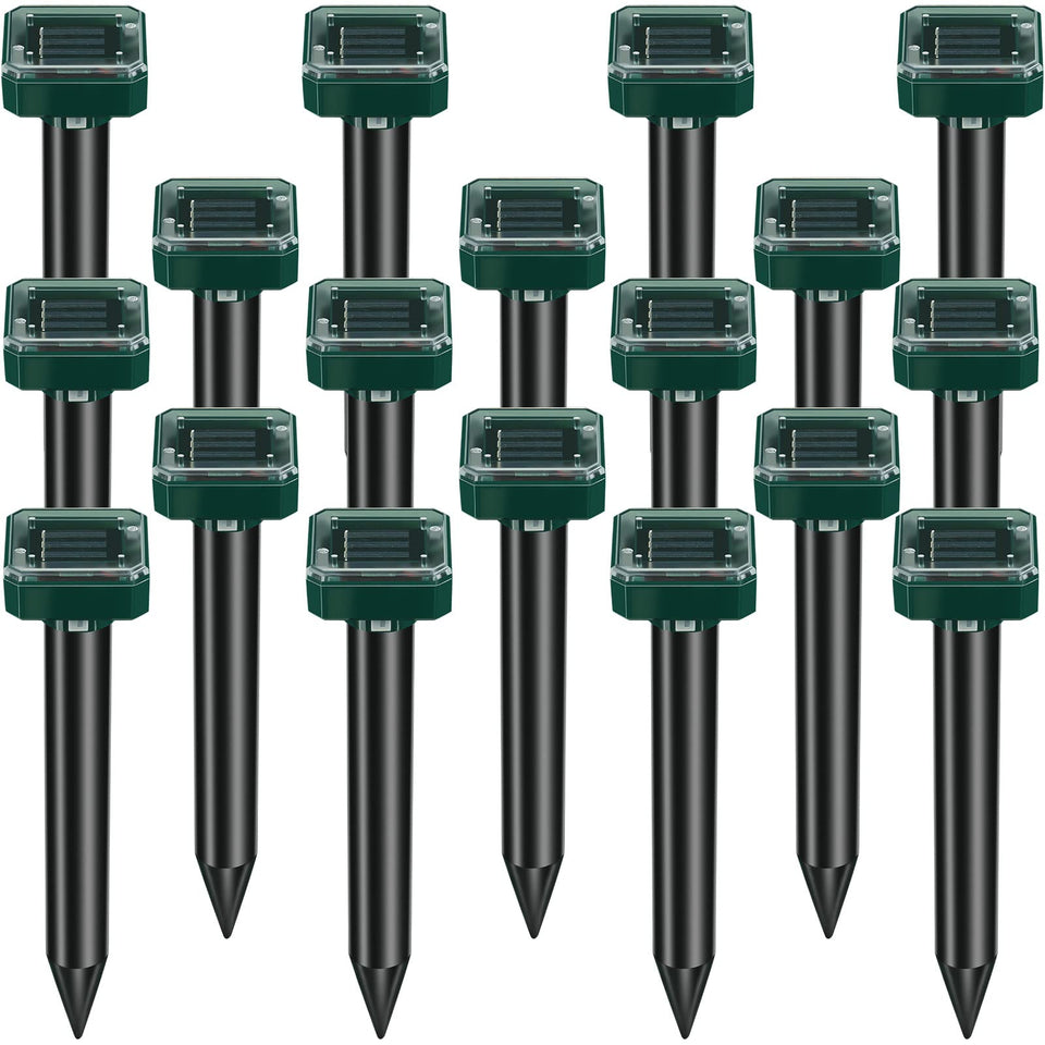 Kittmip mole repellent stake deters moles in a sunlit lawn