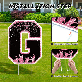 KLYRO cap and diploma symbols on a large yard sign.