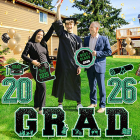 KLYRO green congrats signs create a vibrant outdoor backdrop