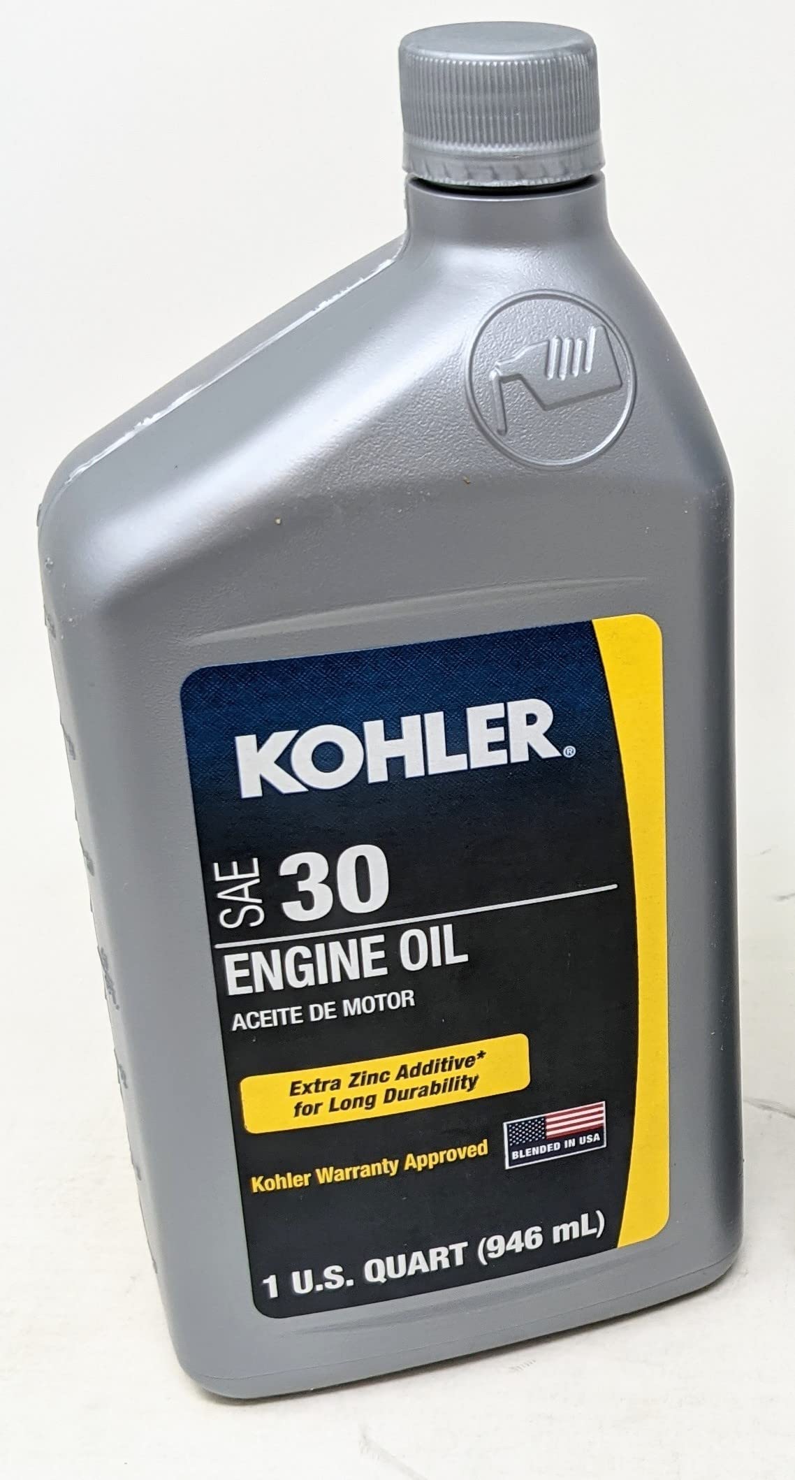 Kohler Oil 30W 1QT pouring action shows controlled flow for spills-free use.