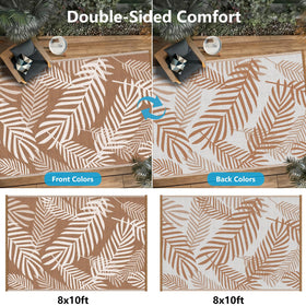 Kohree leaf-pattern reversible rug offering two looks for outdoor spaces