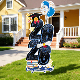 KOITHE 2026 graduation yard sign in blue with stakes displayed on a sunny lawn.