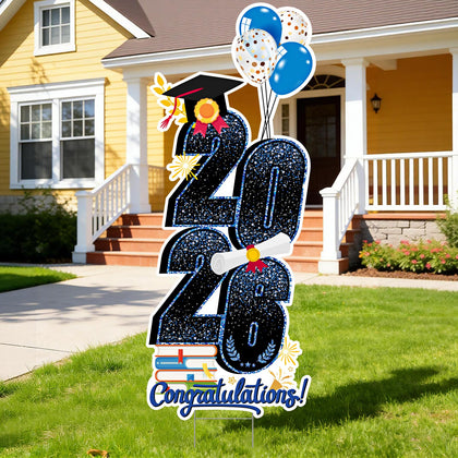 KOITHE 2026 graduation yard sign in blue with stakes displayed on a sunny lawn.