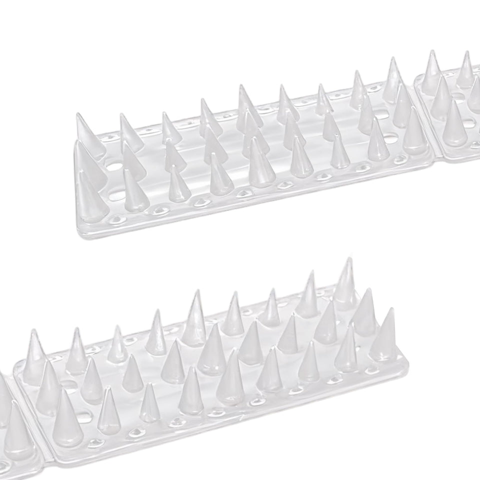 KOKMEYA Bird Spikes on a fence deter pigeons while keeping outdoor areas clean.