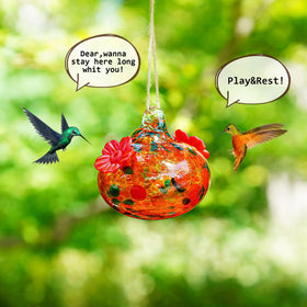 KRISININE hand-blown feeder includes hook and twine for easy hanging.