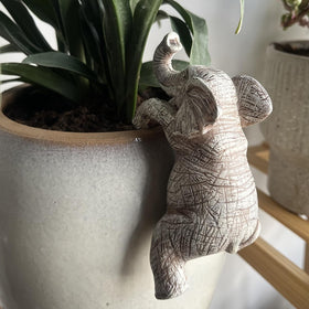Kudriod elephant planter adds whimsical charm to outdoor spaces.