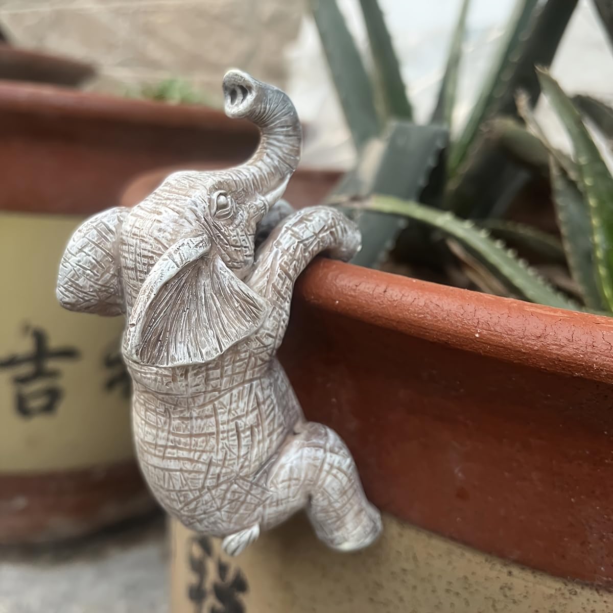 Kudriod indoor flower pot holder elephant brightening indoor space.