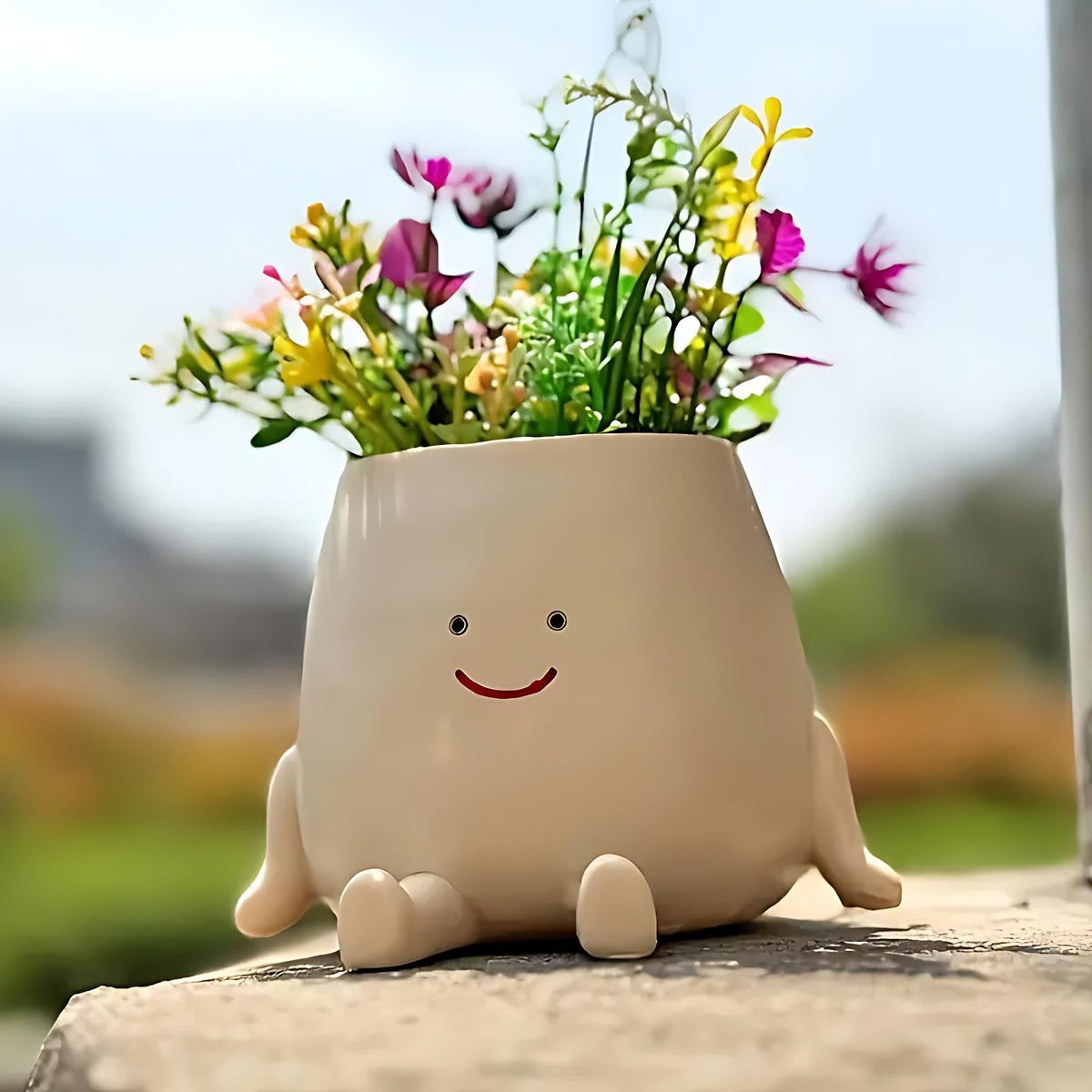 Kudriod Smiley Face Planter Pot on desk with small succulent for a cheerful workspace