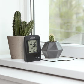 La Crosse 314-1410 thermometer monitors humidor temperature for cigar storage.