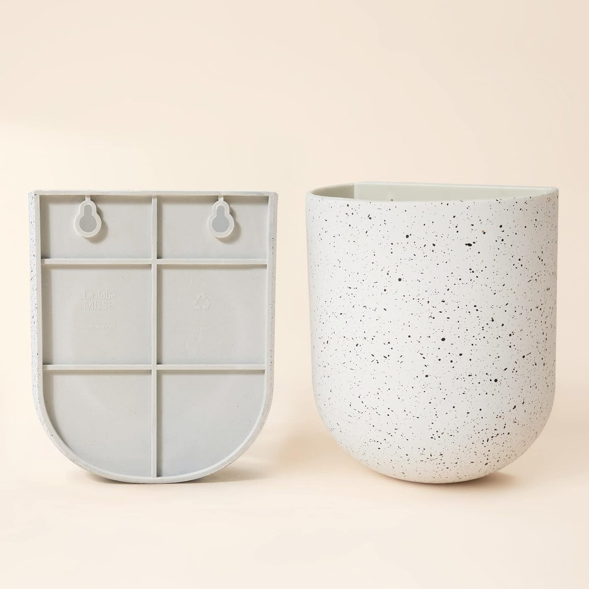 LA JOLIE MUSE set of two wall planters creates versatile display.