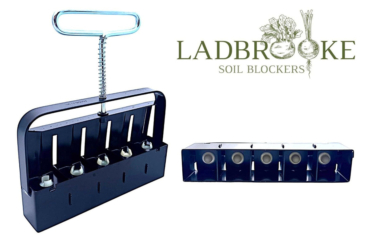 Ladbrooke Mini 5 ejection handle releasing a soil block for potless sowing.