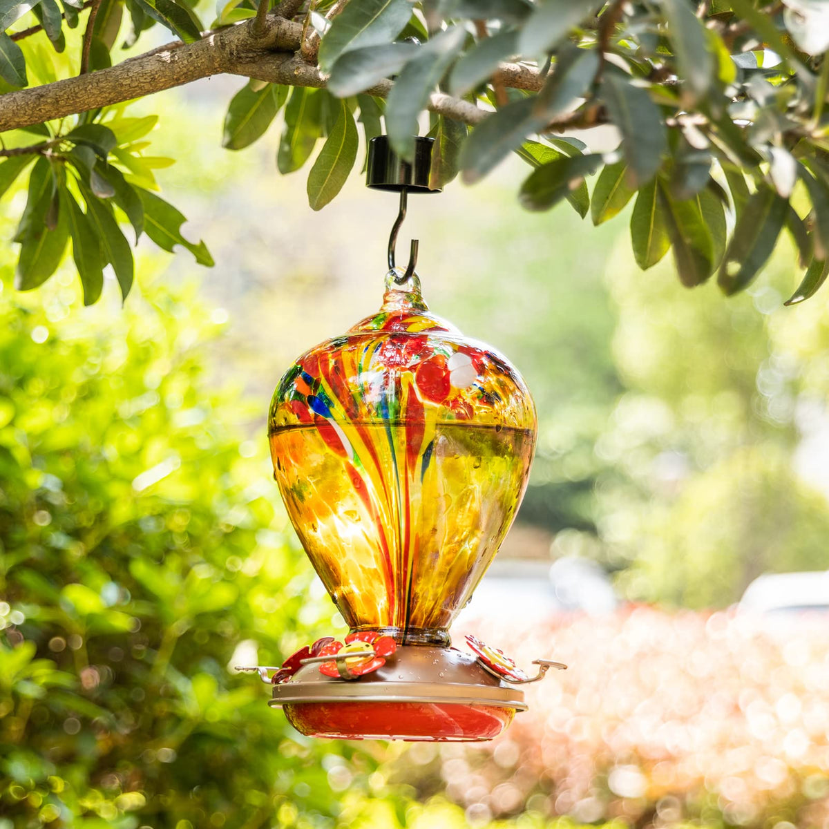LaElvish Garden Hand Blown Glass Hummingbird Feeder adds durable elegance to your garden.