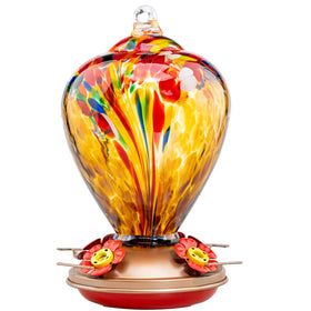 LaElvish Garden Hummingbird Feeder 34oz glass shines in sun, inviting birds to a lively backyard visit.