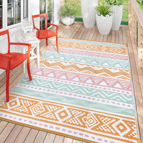 Lahome outdoor rug in pink showcases reversible design for quick space refresh.