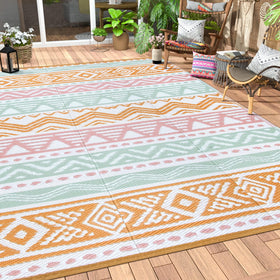 Lahome outdoor rug 6x9 in pink and orange, waterproof and easy to rinse.