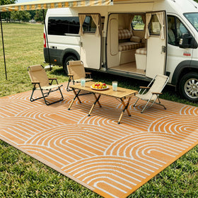 Lahome folded-compact rug demonstrates portability for quick camping setups.