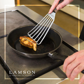 Lamson brass rivets secure the walnut handle for durability.