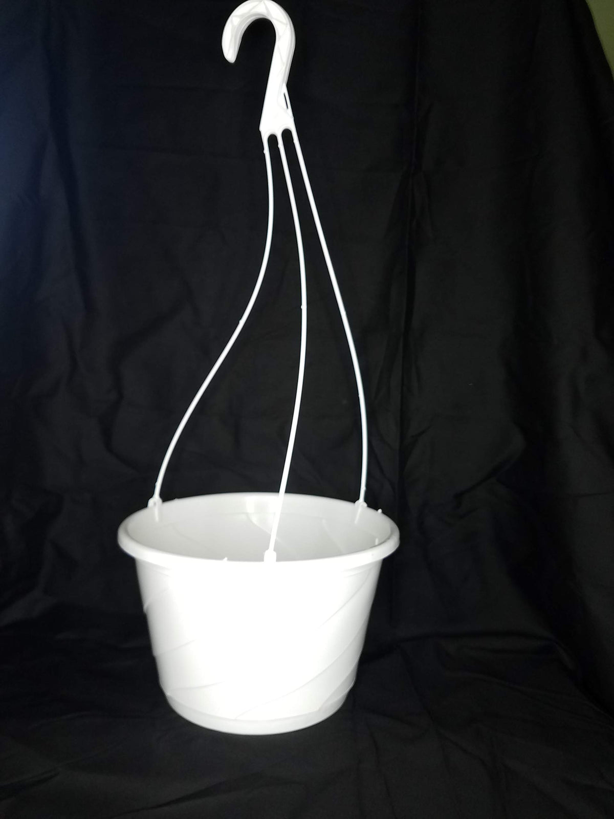 Landmark Plastics Contempo Swirl interior saucer supports drainage and plant health.