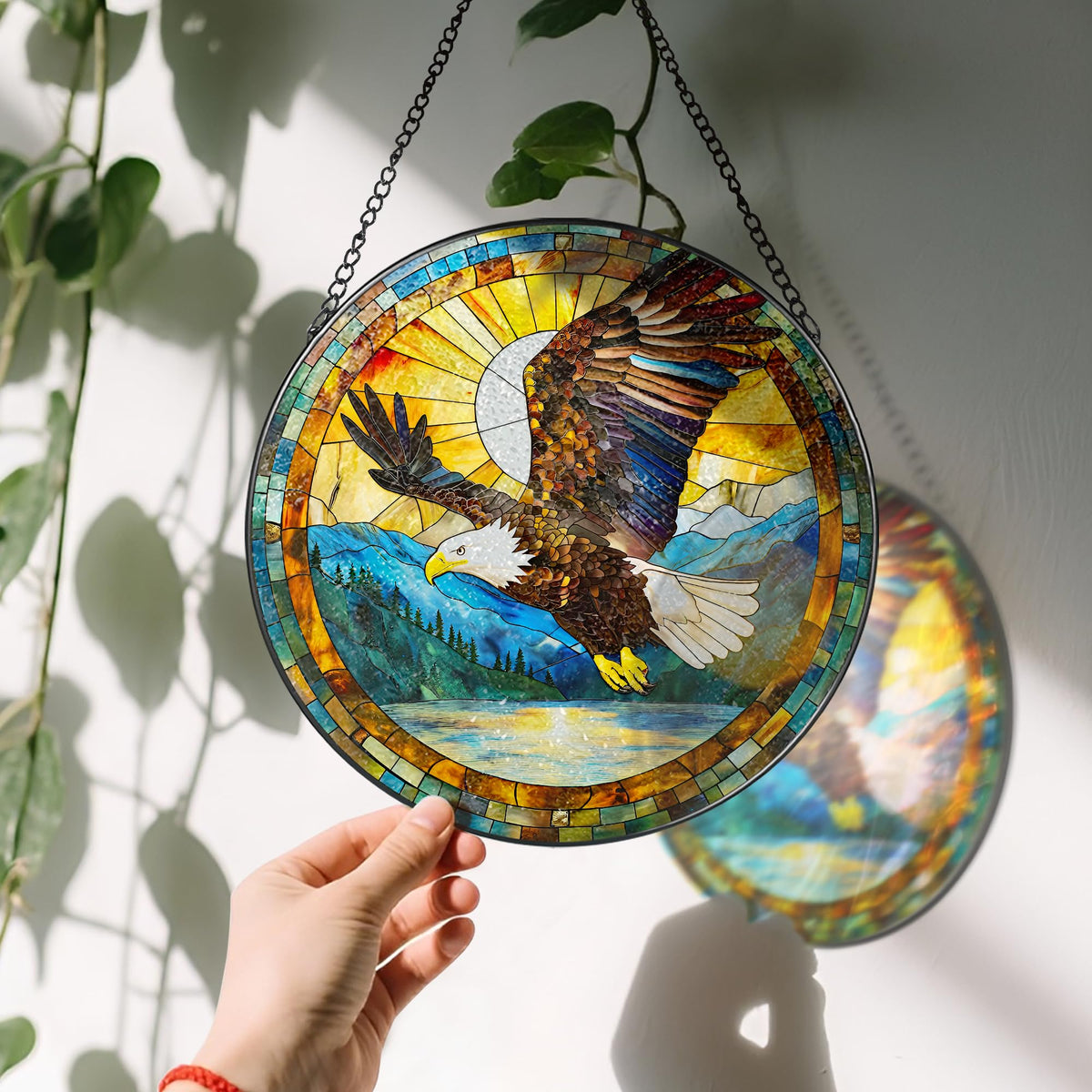 Laoweiki 8 inch suncatcher with black frame reflects sunlight beautifully.
