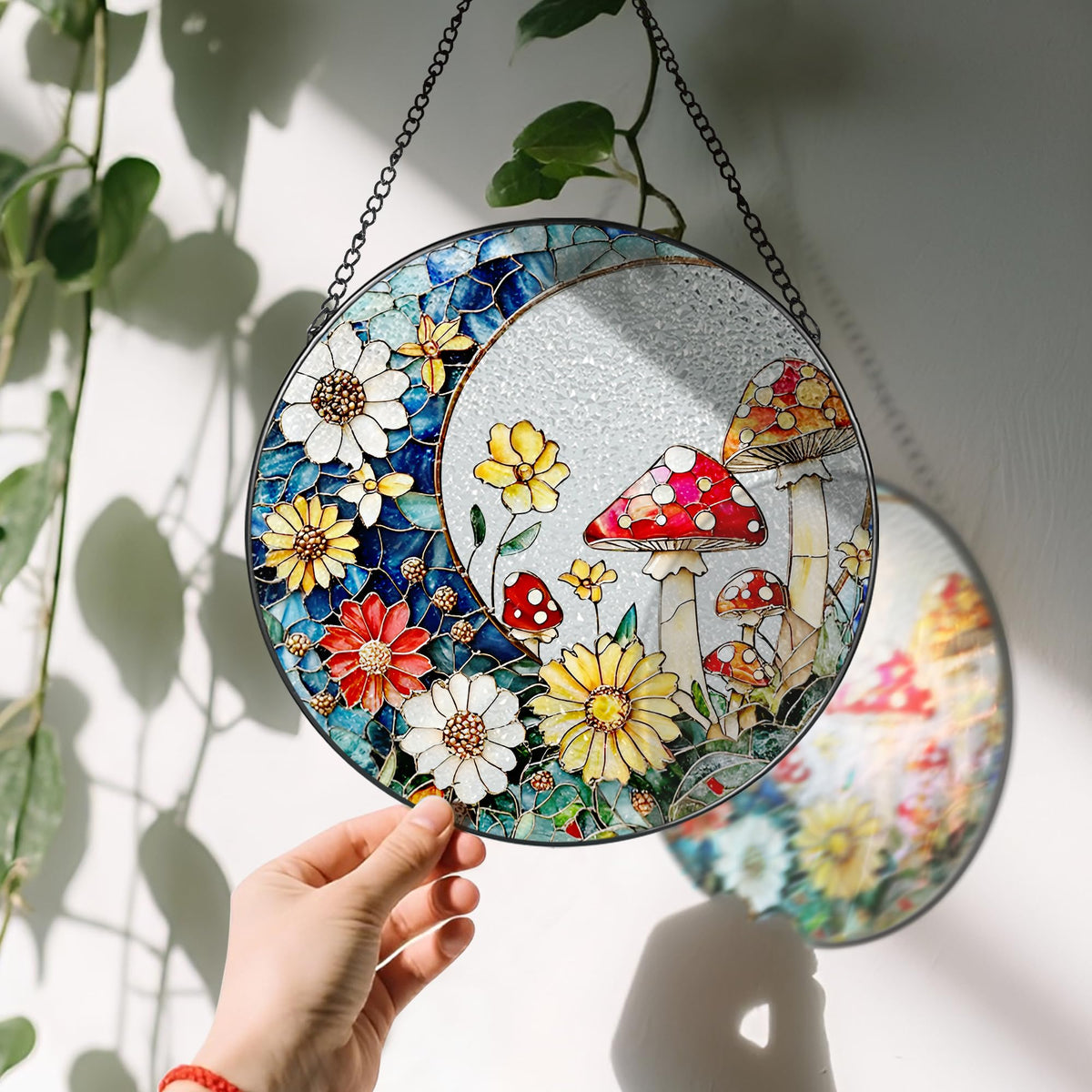 LAOWEIKI mushroom suncatcher with black frame delivers lasting color in bright light.