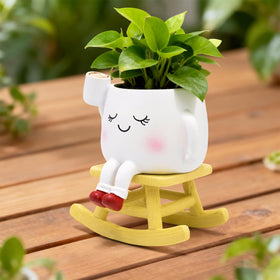 LAUGOKOBE Smiley Face detail planter featuring a book and coffee mug for cozy decor
