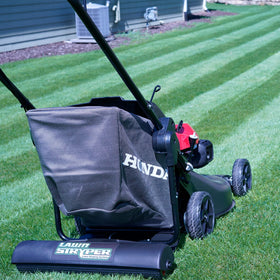 Lawn Stryper Gen 3 cover attached to Honda mower enables simultaneous mowing and stripe patterning