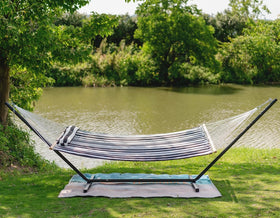 Lazy Daze Hammocks hanging between trees with ample space for two.
