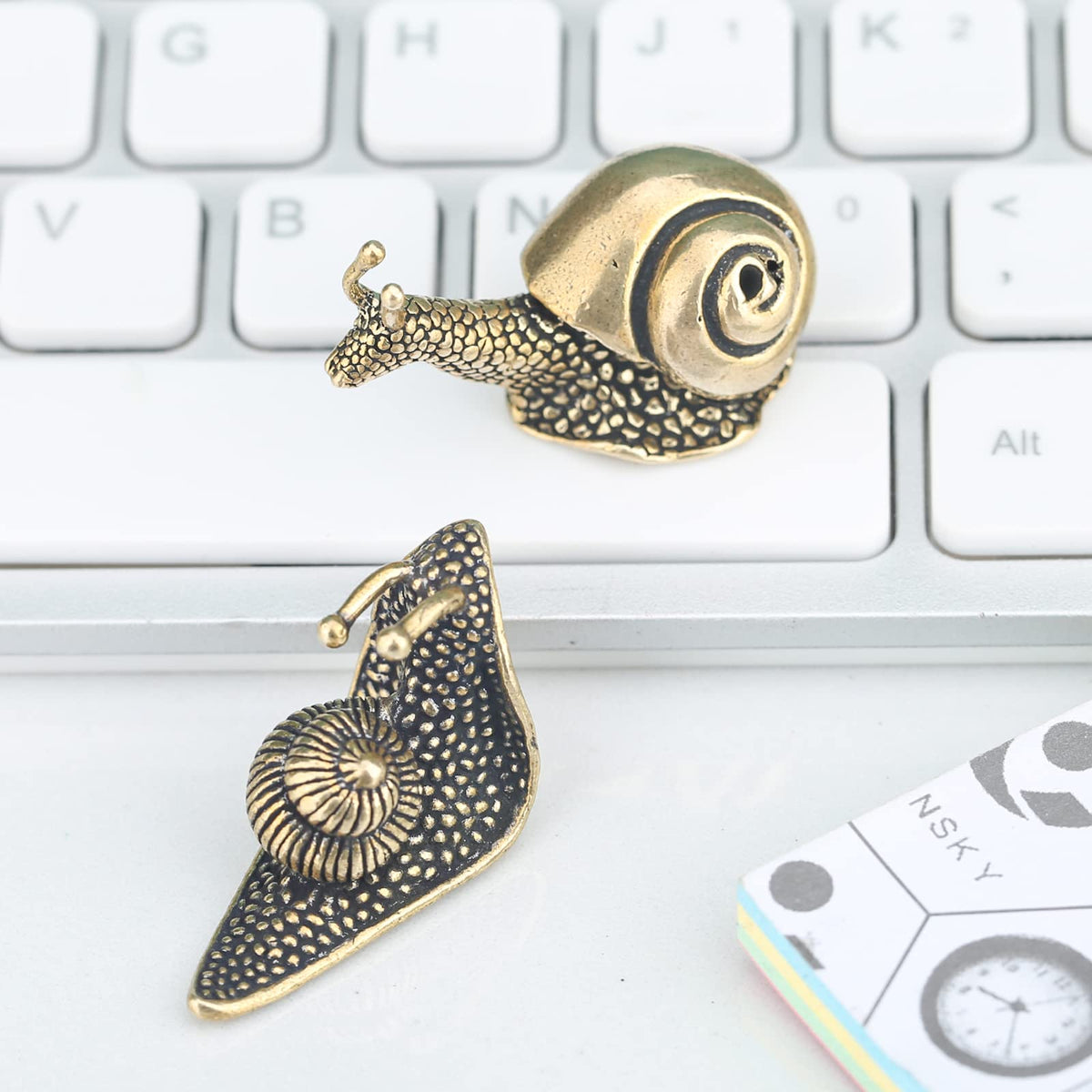 LCCCK brass snail terrarium decor brings nature-inspired charm.