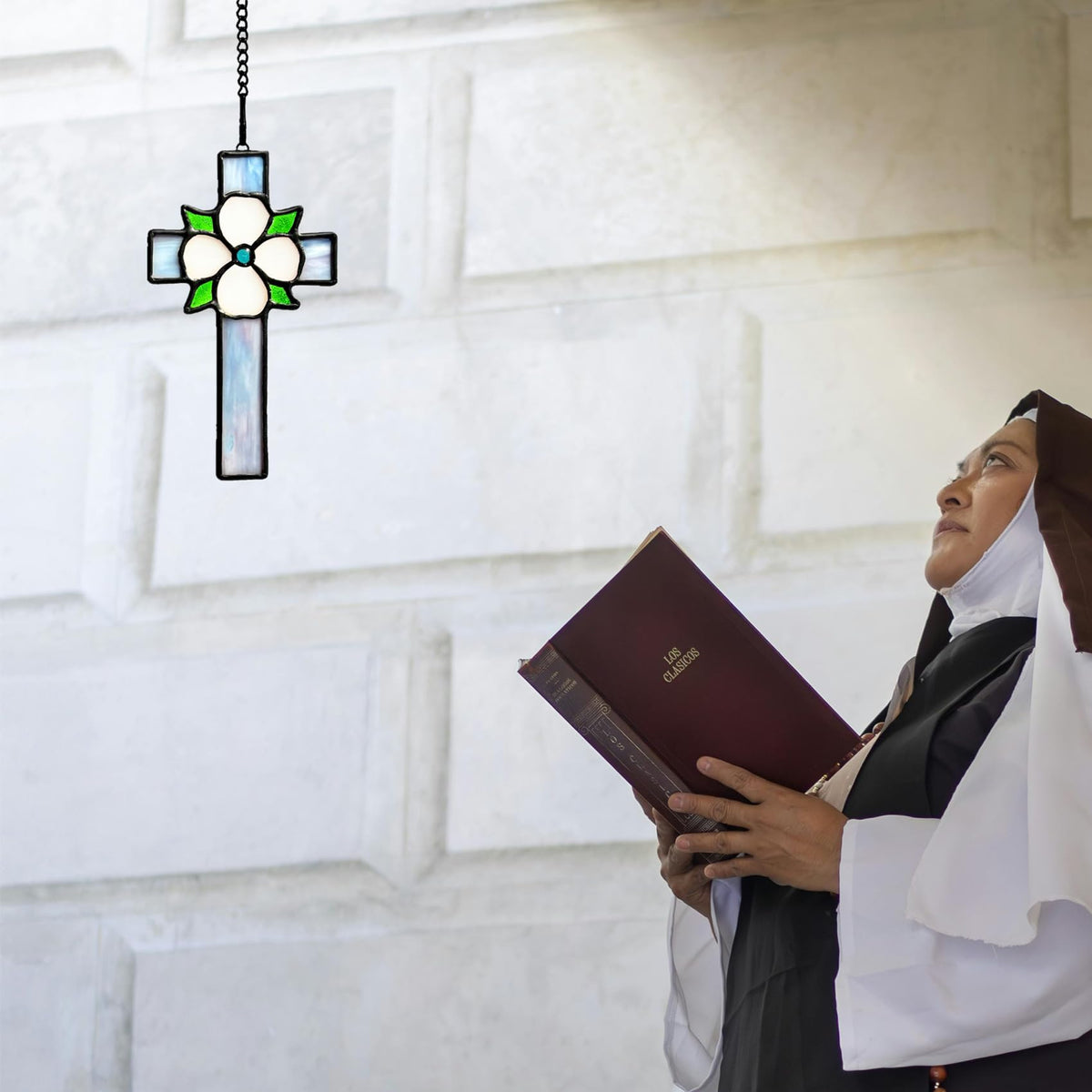 Lcensp flower cross suncatcher catches sunlight, revealing vivid colors.