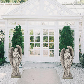 LCdecohome entryway statue adds inviting religious focal point.