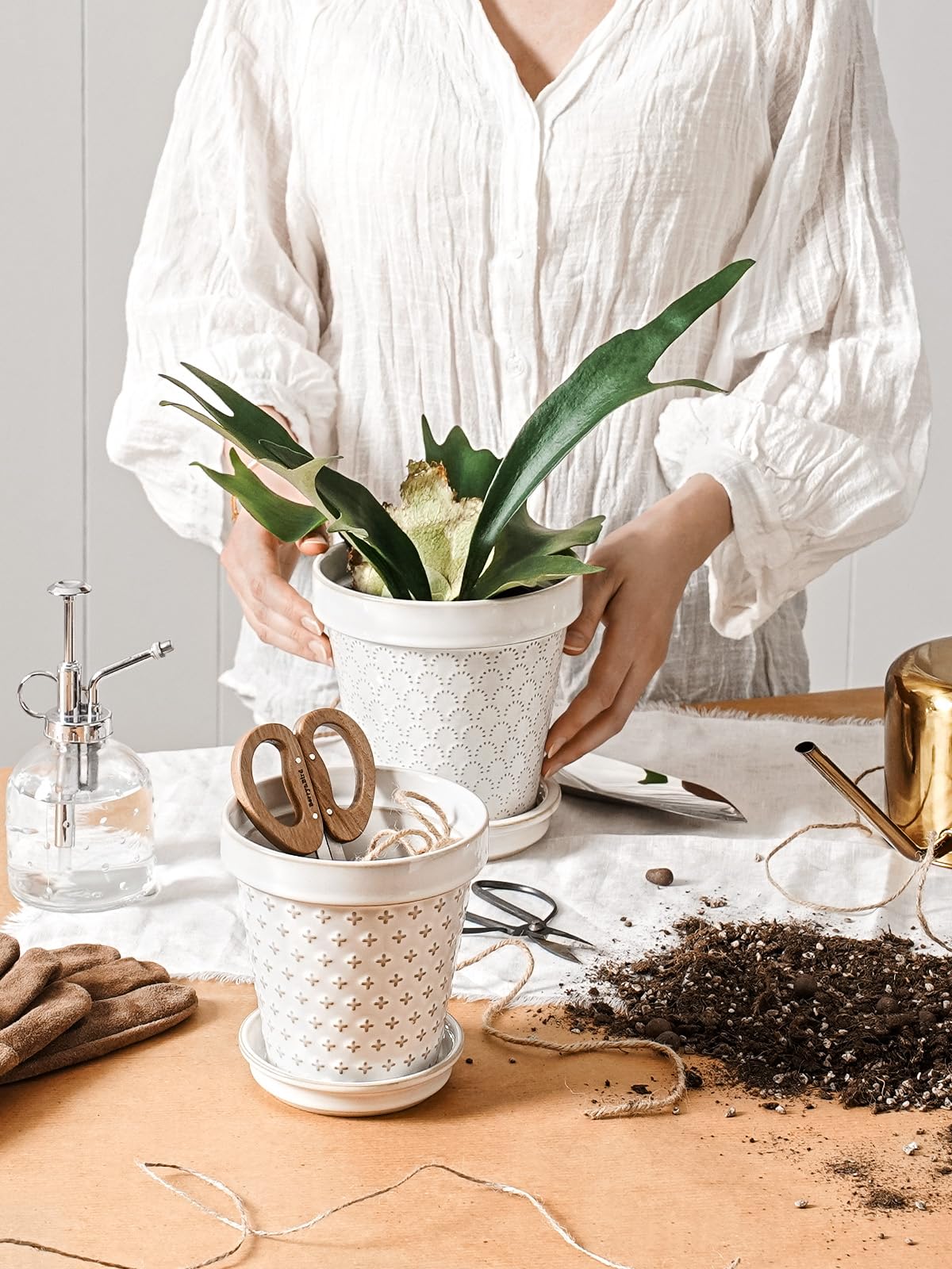 LE TAUCI set of 4 ceramic pots for versatile indoor display.