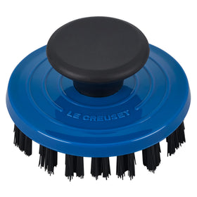 Le Creuset grill pan brush dishwasher-safe feature highlighted with clean surface after use.