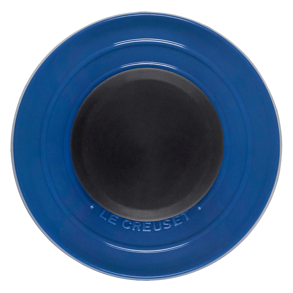 Le Creuset grill pan brush handle detail emphasizes ergonomic grip and durable construction.