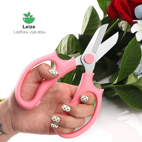 Leize green slender floral shears positioned for bouquet preparation and floral art.