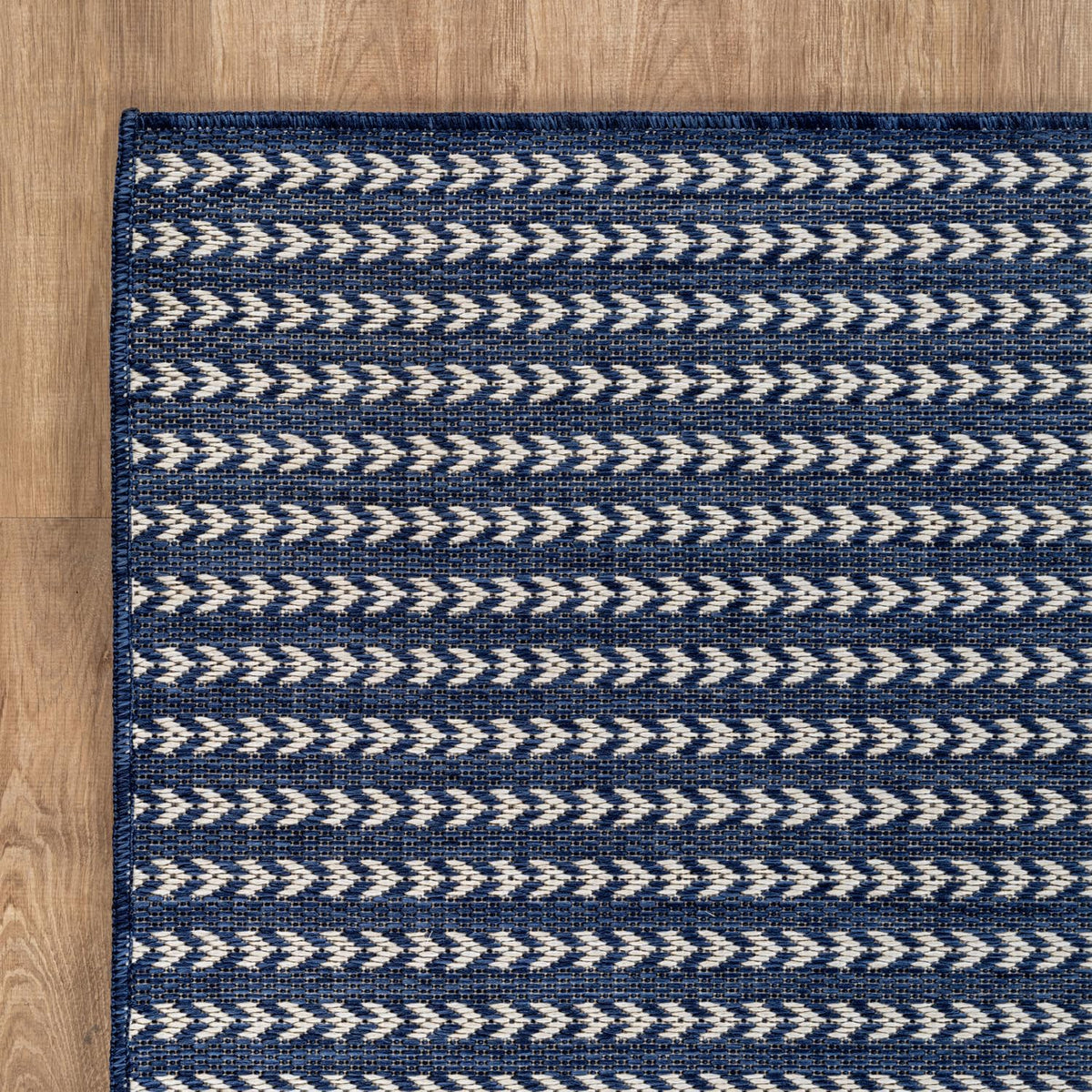 Lena Rug easy-clean outdoor rug; hose wash or vacuum for quick maintenance.