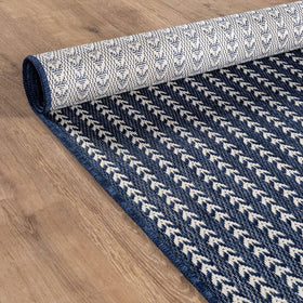 Lena Rug waterproof rug cleans easily with hose or vacuum.
