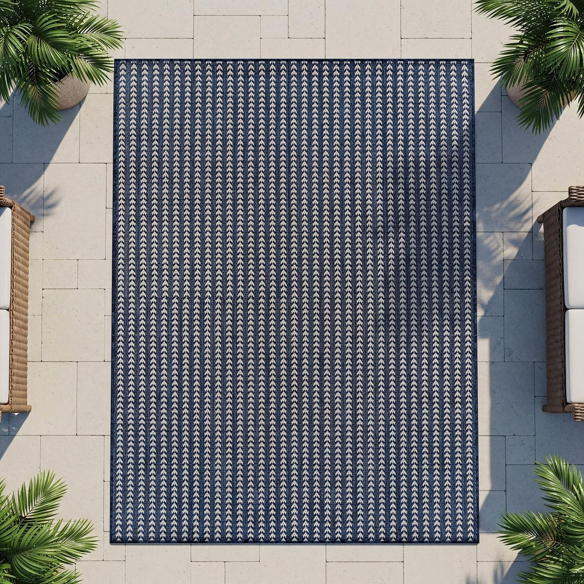 Lena Rug navy outdoor rug enhances porch spaces with color and structure.