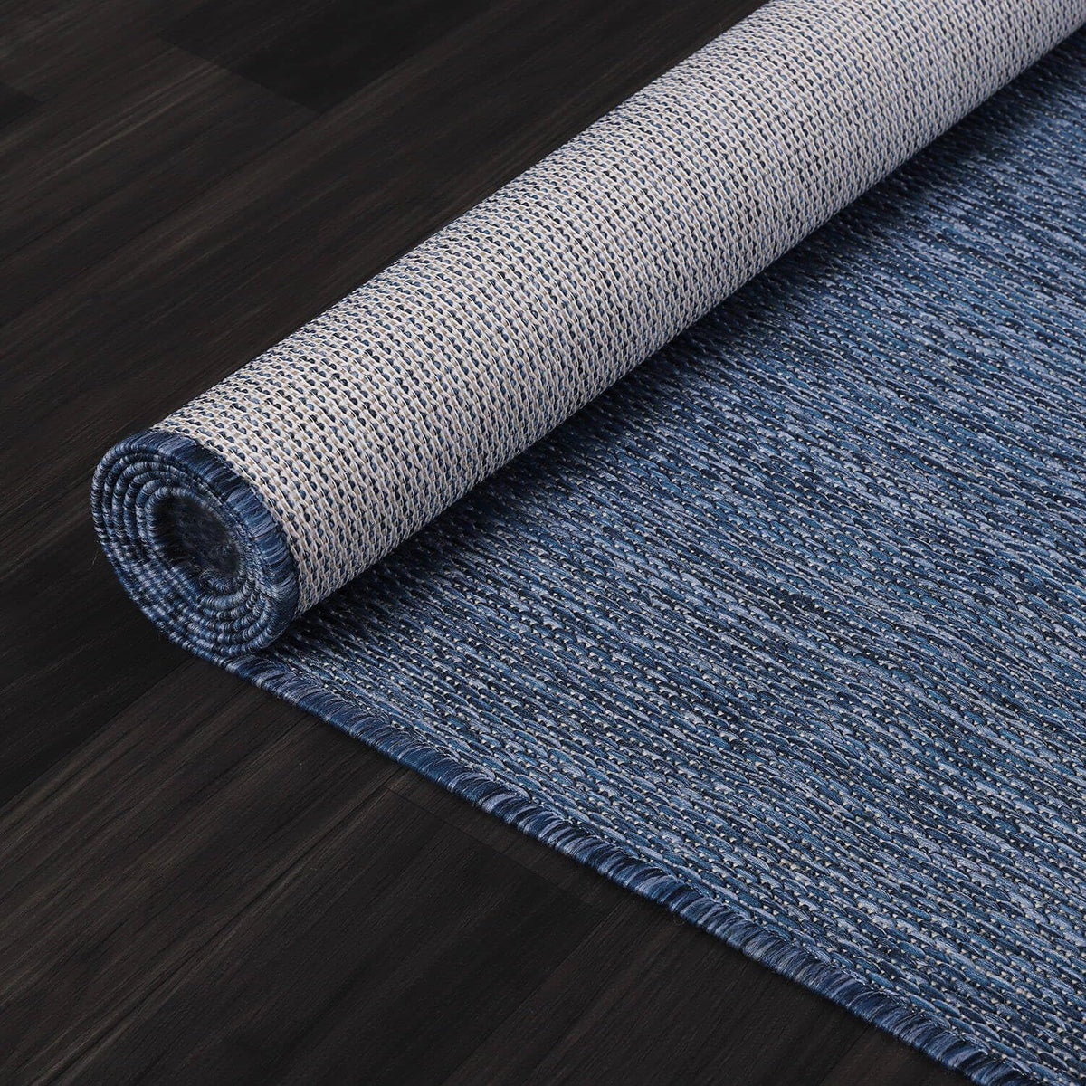 Lena Rug Azure Blue backyard rug helps define spaces with durable, mess-friendly fibers