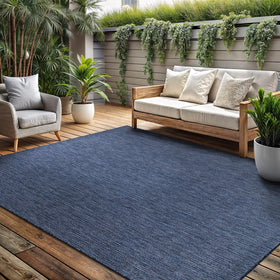 Lena Rug Azure Blue outdoor rug on patio supports versatile outdoor living and easy upkeep