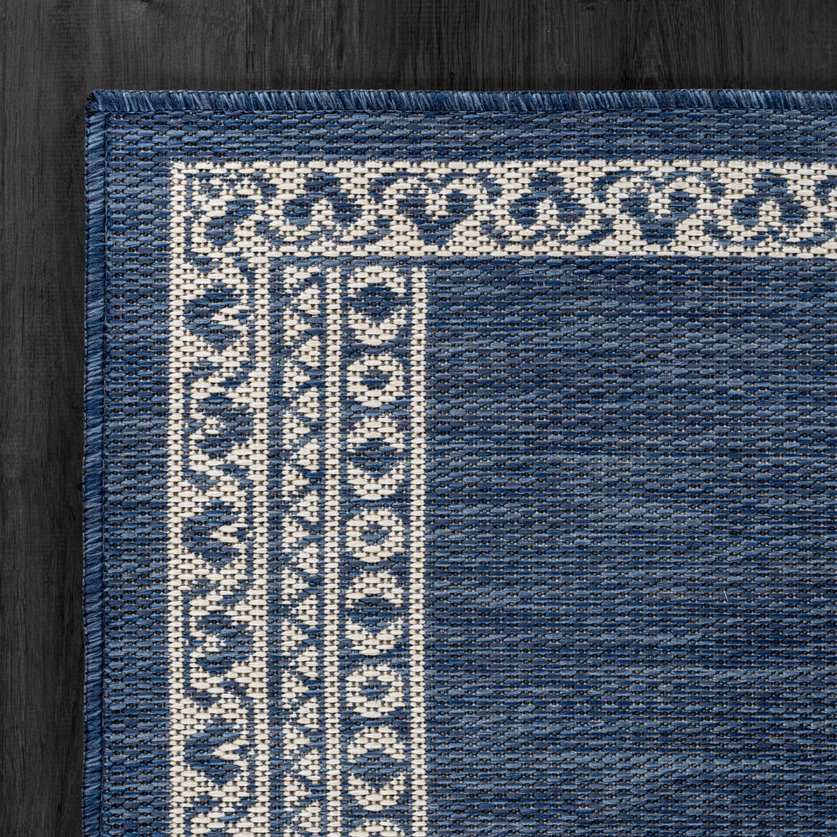 Lena Rug waterproof UV-resistant blue rug resists sun and moisture for outdoor durability.