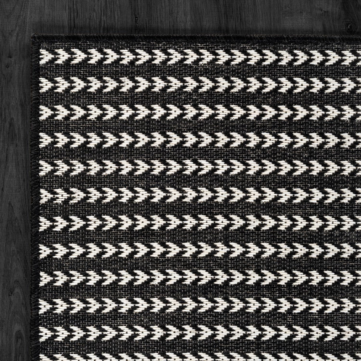 Lena Rug waterproof fibers resist sun and rain on decks.