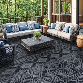 Folded LIANLAM rug with carry bag for easy transport