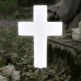 Lifeholic Solar Cross Light white grave design illuminates outdoor remembrance softly.