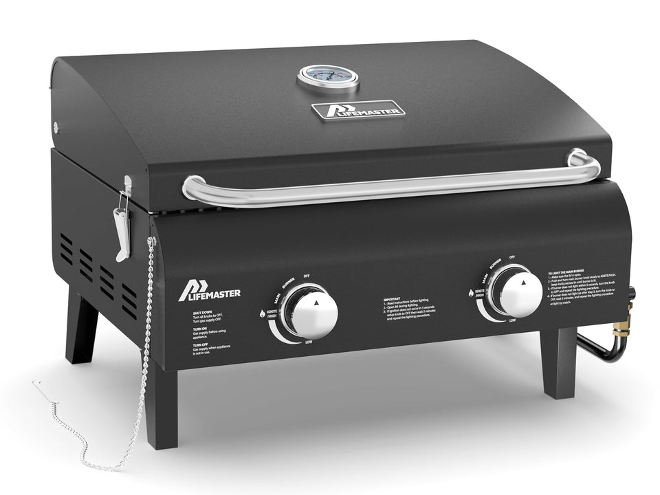 Lifemaster black portable gas grill with dual burners delivering even heat for searing.