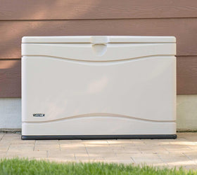 LIFETIME deck box in an outdoor setting near tools.